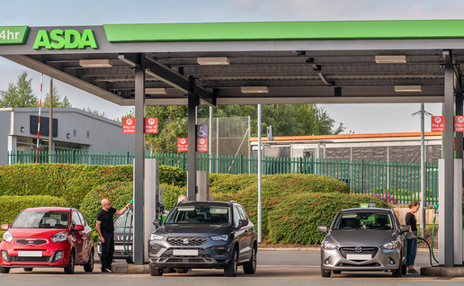 Drivers fill up their cars at an ASDA petrol station.