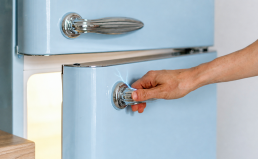 Hand gets electric shock from appliance.
