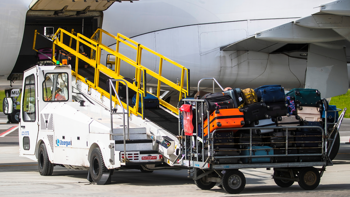 Pile of bags about to be loaded onto an aircraft.