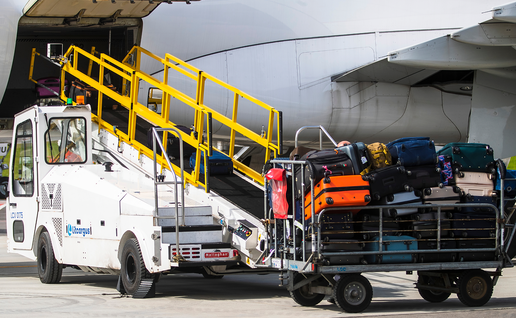 Pile of bags about to be loaded onto an aircraft.