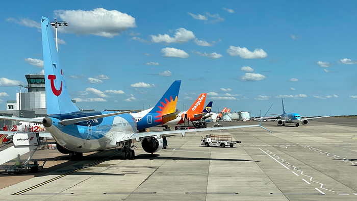 Airplanes on runway at Bristol Airport.