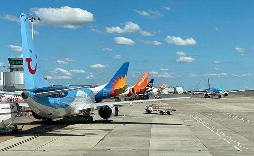 Airplanes on runway at Bristol Airport.