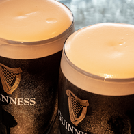 Two fresh pints of Guiness.