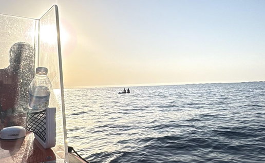Paddleboarders in trouble.