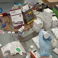 Tables covered with medicine boxes during a National Police seizure.