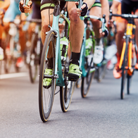 Many cyclists riding close together during a race.