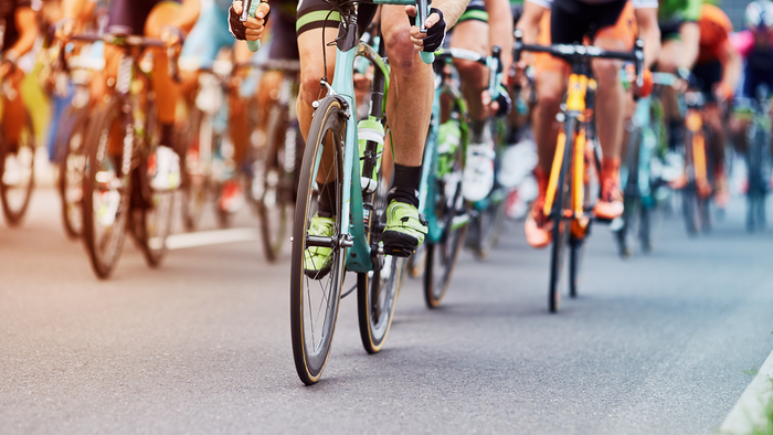 Many cyclists riding close together during a race.