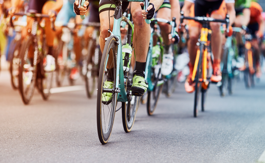 Many cyclists riding close together during a race.