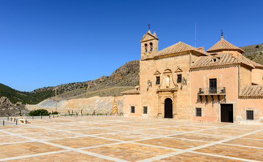 Exterior of the Santuario del Saliente church and plaza near Albox, Almería, with mountains behind.