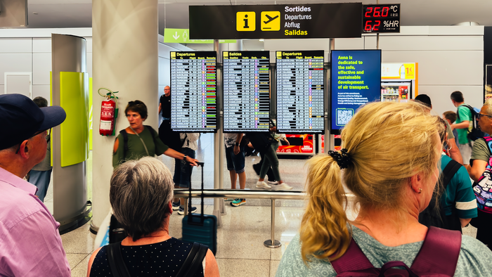 Passengers waiting in Palma airport for information on their flights