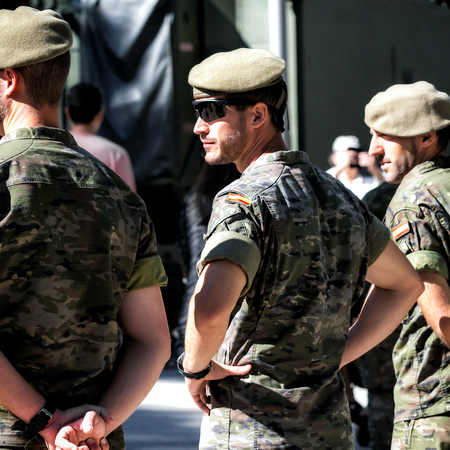 Three Spanish soldier standing next to each other
