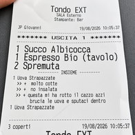 A photo of a restaurant receipt in Italian