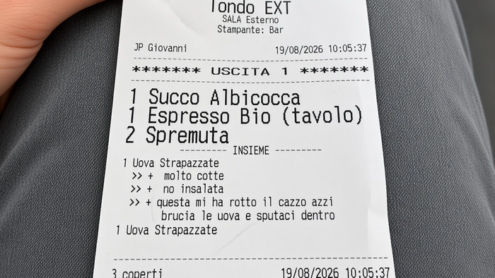 A photo of a restaurant receipt in Italian