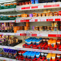 A refrigerated section in the supermarket with ready to go coffee