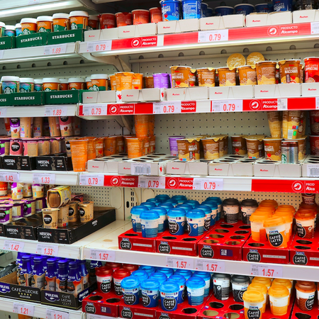 A refrigerated section in the supermarket with ready to go coffee