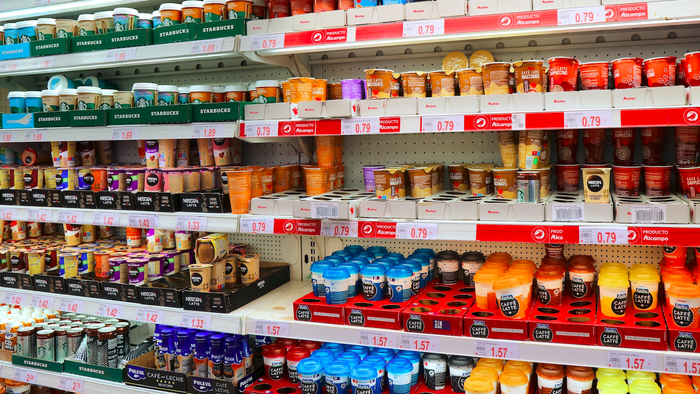 A refrigerated section in the supermarket with ready to go coffee