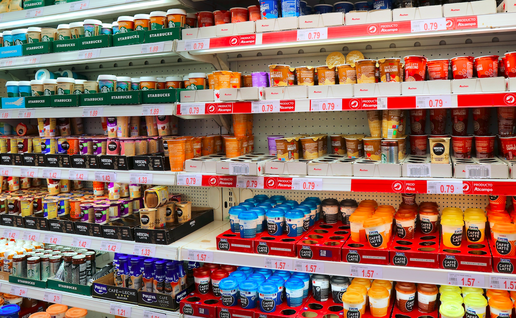 A refrigerated section in the supermarket with ready to go coffee