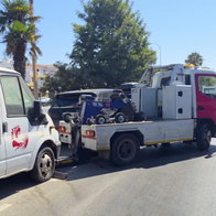 Marbella police towing away dusty cars.