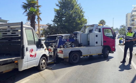 Marbella police towing away dusty cars.