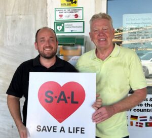 Ismael, defibrillator installer, and Gerry Hannam.