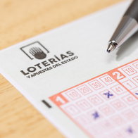 Close up of. alogo of Loterias y Apuestas del Estado Lottery ticket