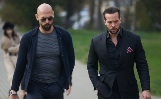 Andrew and Tristan Tate walking together as lawyers challenge claims about their luxury lifestyle Title: Andrew and Tristan Tate luxury lifestyle claims