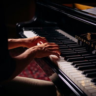 A musician playing the piano.