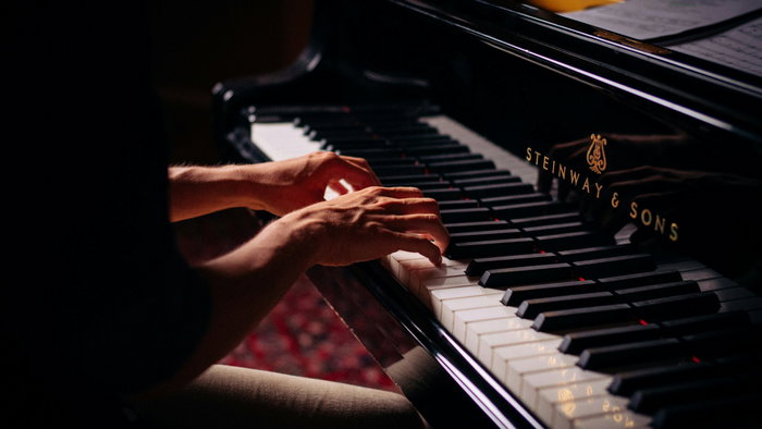 A musician playing the piano.