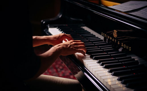 A musician playing the piano.