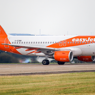 An easyJet aircraft on an airport runway.