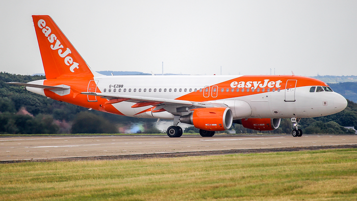 An easyJet aircraft on an airport runway.