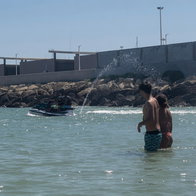 A jet skier in a bathing area on popular Spanish beach