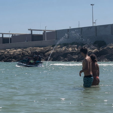 A jet skier in a bathing area on popular Spanish beach