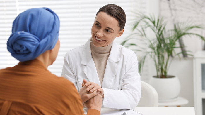 Cancer patient speaking with a doctor about treatment during a medical consultation