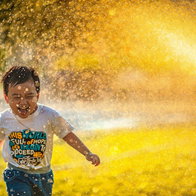 A boy playing in the water.