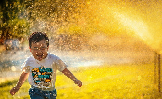 A boy playing in the water.