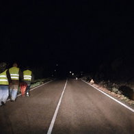 people walking on the road at night