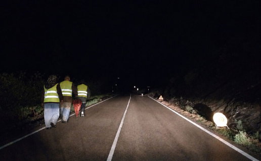 people walking on the road at night