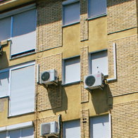 Air conditioning units on side of block of flats in Spain