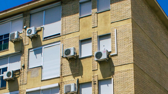 Air conditioning units on side of block of flats in Spain