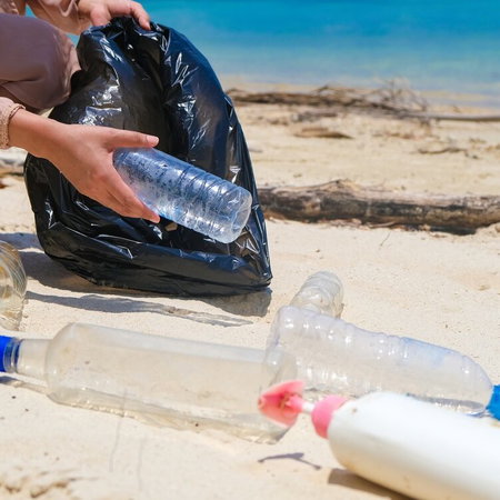 Collecting plastic bottles on the beach