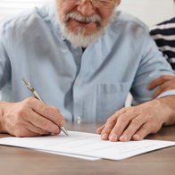 Signing a will.