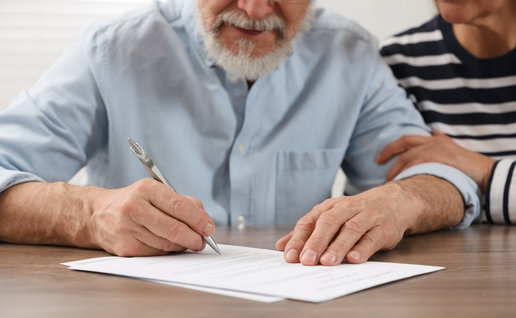 Signing a will.