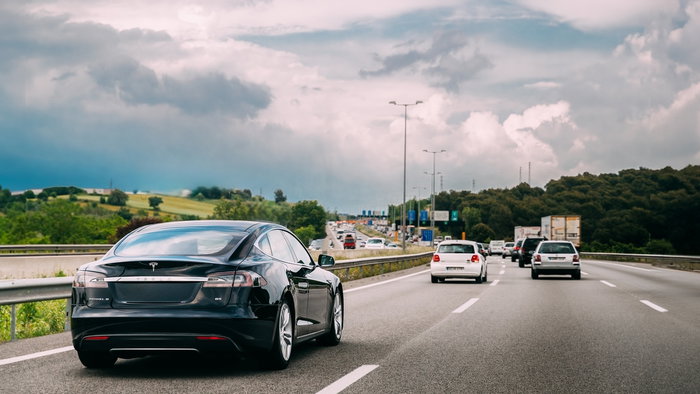 Cars driving fast on motorway