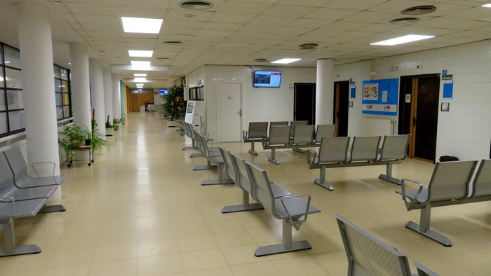 An empty waiting room inside of a doctors surgery in Spain