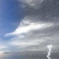 sunny blue skies and rainy storm clouds
