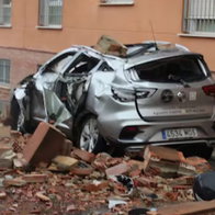 Car covered with post-earthquake rubble