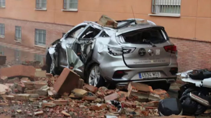 Car covered with post-earthquake rubble