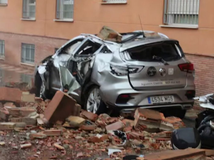 Car covered with post-earthquake rubble