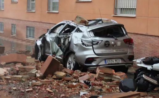 Car covered with post-earthquake rubble
